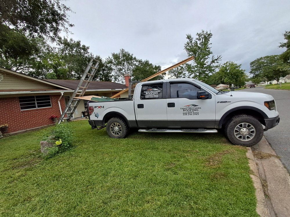 Slide of Three Brothers Roofing