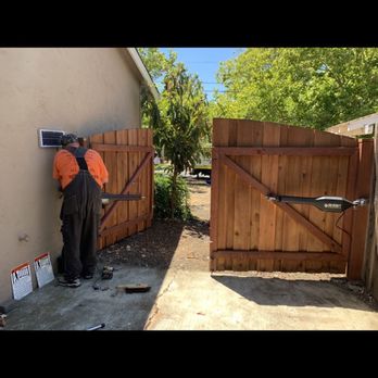 Ask Jim to Fix It - Jim finishing up installing my gate opener to solar panel - Electricians Near Me