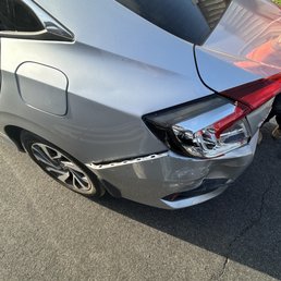 Angled view of car damage Angled view of car damage