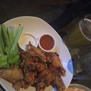 Yard House - Traditional wings with buffalo and ranch sauce on the side - New American Near Me - Rancho Mirage, California Yard House - Traditional wings with buffalo and ranch sauce on the side - New American Near Me - Rancho Mirage, California