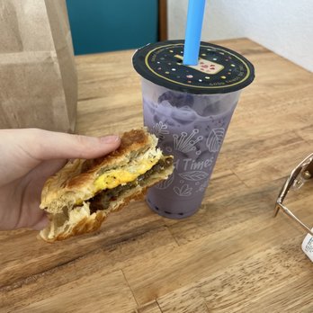 Daily Donuts - Sausage, egg & cheese croissant. Taro boba tea - Bubble Tea Near Me - Orange Park, Florida