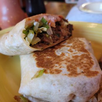Taqueria El Mariachi - a burrito on a yellow plate - Mexican Near Me - Georgetown, South Carolina Taqueria El Mariachi - a burrito on a yellow plate - Mexican Near Me - Georgetown, South Carolina