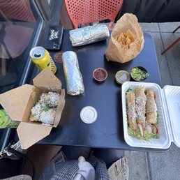 beef barbacoa burrito (top), elote (left), tacos dorados (right)