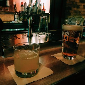 Rosedale - a glass of alcohol and a glass of beer on a bar - Bars Near Me - Cincinnati, Ohio
