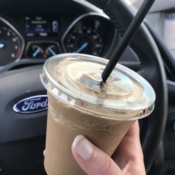 Magnum Coffee Roastery - a hand holding a cup of coffee - Coffee & Tea Near Me - Nunica, Michigan Magnum Coffee Roastery - a hand holding a cup of coffee - Coffee & Tea Near Me - Nunica, Michigan
