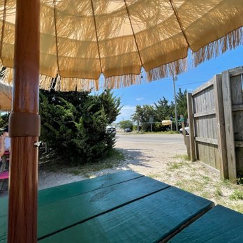 Eduardo's - a view of a picnic table and umbrella - Mexican Near Me - Ocracoke, North Carolina