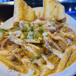 Front Row Bar - Eatery - Events - Cajun pasta extra  and shrimp are cooked
