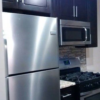 Netty's Multiservices - a kitchen with stainless steel appliances - General Contractors Near Me Netty's Multiservices - a kitchen with stainless steel appliances - General Contractors Near Me