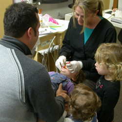 Kids Care Dental Elk Grove - Even the hygienist gets the whole family involved.