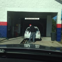 Tiger Point Express Car Wash - Manually helps get bug grime off.