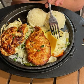 TGI Fridays Herndon - a plate of food on a table - American Near Me - Herndon, Virginia