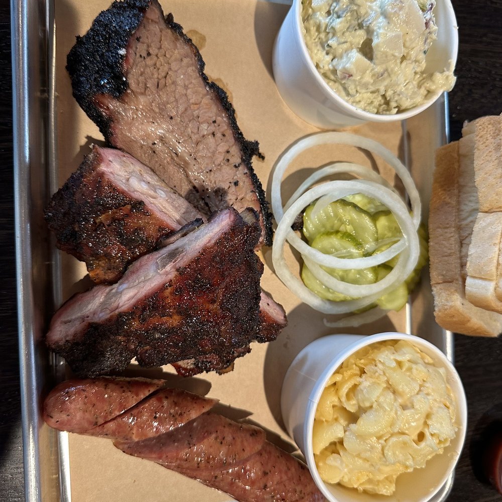 True Texas BBQ - 3 meat plate, moist brisket, sausage, ribs, with potato salad and mac&cheese - Barbeque Near Me - Austin, Texas True Texas BBQ - 3 meat plate, moist brisket, sausage, ribs, with potato salad and mac&cheese - Barbeque Near Me - Austin, Texas