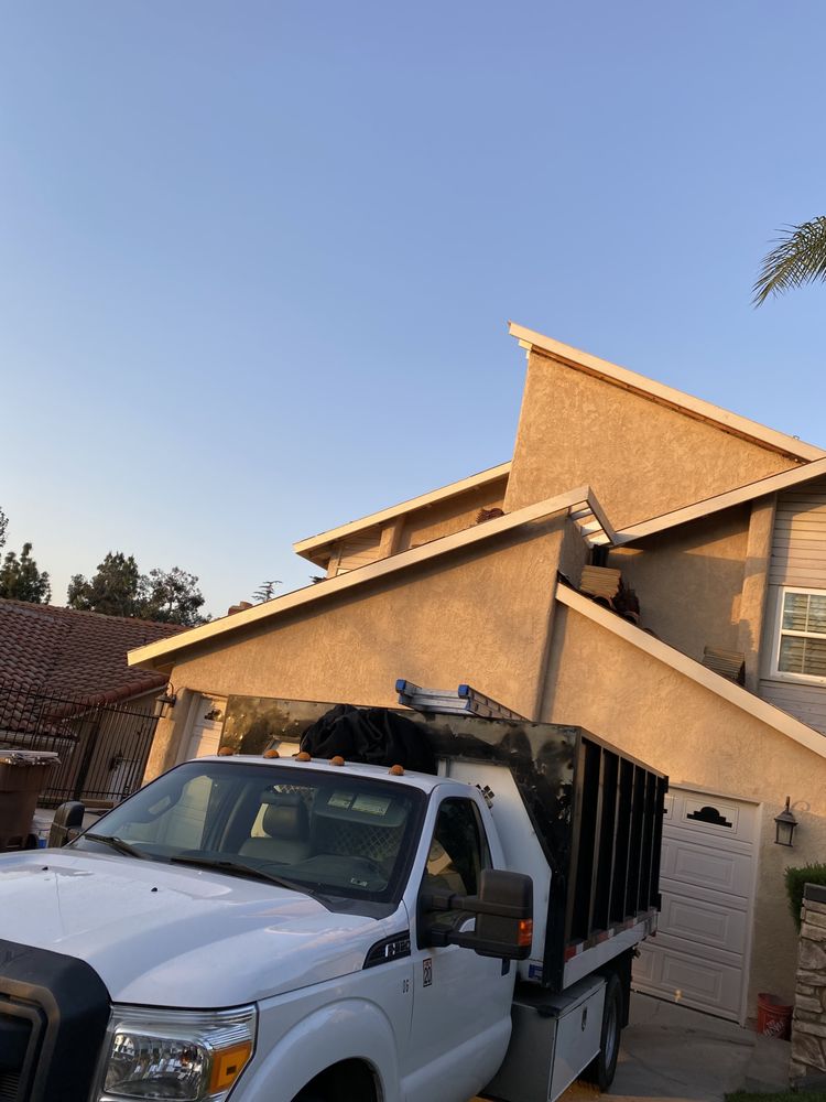 Slide of Green Ladder Roofing