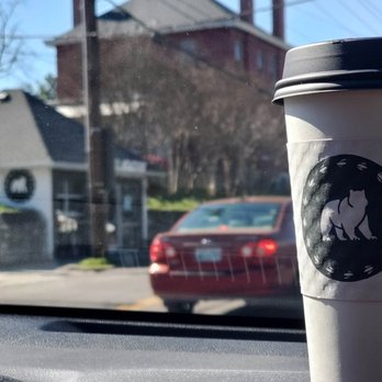 Osa Coffee Roasters - a cup of coffee on the dashboard of a car - Coffee Roasteries Near Me - Nashville, Tennessee