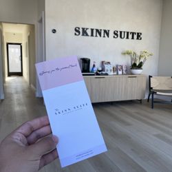 The Skinn Suite Aesthetic Center - Reception area with a full coffee station.
