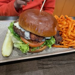 The Buckley Kitchen & Bar - 8 oz. Angus Burger with Bacon, Cheese, and Sweet Potato Fries.