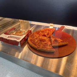 a pizza with a slice missing