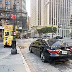 NYPD - Midtown North Precinct - Ronnie Lamber sits in his car illegally parked. Covers 10 stands
