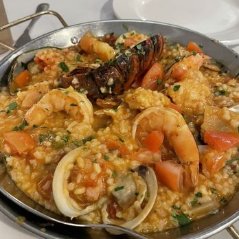 Caldeiras Restaurant - Paella- was able to share for 2. We did order an appetizer first. Pairs well with Italian Riesling. - Portuguese Near Me - Fall River, Massachusetts