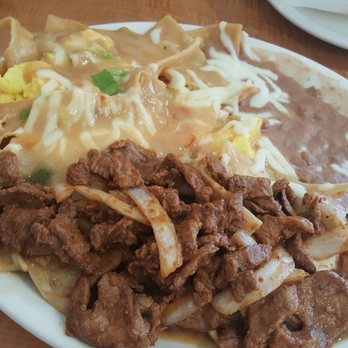 Loaded Cafe - Long Beach - The best asada chilaquiles in my life! The spicyness in the sauce was perfect and the asada was so tender and flavorful! - American Near Me - Long Beach, California