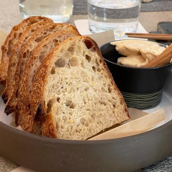 River Twice - Mighty Bread corn porridge sourdough with sorghum molasses vinegar butter - New American Near Me - Philadelphia, Pennsylvania