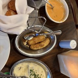 Complimentary sides: fried plantains, mashed potatoes, cheese bread are good. Lobster bisque, don't love