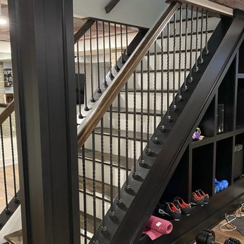 Coastline Renovations - a staircase in a home gym - General Contractors Near Me Coastline Renovations - a staircase in a home gym - General Contractors Near Me