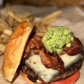 BJ's Restaurant & Brewhouse - Bacon-Guacamole Deluxe Burger* and Fries - Breweries Near Me - Bloomington, Indiana BJ's Restaurant & Brewhouse - Bacon-Guacamole Deluxe Burger* and Fries - Breweries Near Me - Bloomington, Indiana