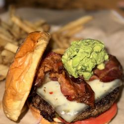 BJ's Restaurant & Brewhouse - Bacon-Guacamole Deluxe Burger* and Fries
