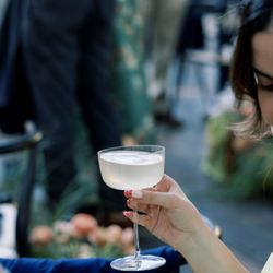 Guest enjoying a classic martini in an elegant glass at a Los Angeles celebration.