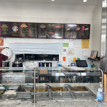 Chaat House - a man preparing food in a restaurant - Indian Near Me - Bothell, Washington