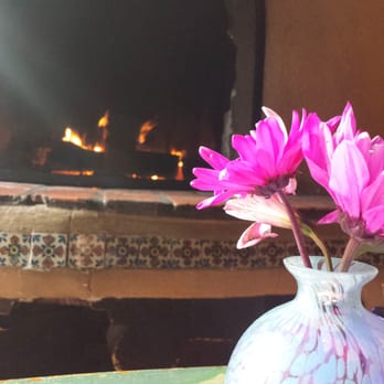 The Pink Adobe - Seated next to a wood fire. Very cute and quaint resturant. - New Mexican Cuisine Near Me - Santa Fe, New Mexico The Pink Adobe - Seated next to a wood fire. Very cute and quaint resturant. - New Mexican Cuisine Near Me - Santa Fe, New Mexico