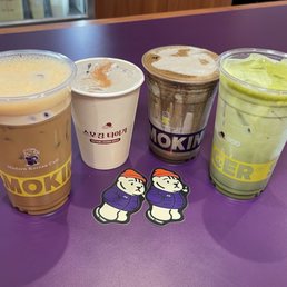 Left to right: Tiger Latte, Black Frost Latte (seasonal), Black Sesame Hojicha (seasonal), Jeju Matcha Latte Left to right: Tiger Latte, Black Frost Latte (seasonal), Black Sesame Hojicha (seasonal), Jeju Matcha Latte