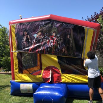Jolly Bouncers - One of the guys setting up the jump - Bounce House Rentals Near Me - Simi Valley, California
