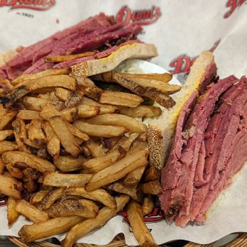 Dunn's - Smoked meat sandwich combo with fries and coleslaw (hiding under the fries). There was a delicious pickle as well! - Burgers Near Me - Greenfield Park, Quebec