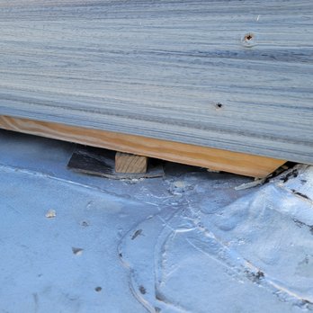 Shield Masonry & Roofing - Small wood under wooden frame piercing roofing material - Masonry/Concrete Near Me - Chicago, Illinois Shield Masonry & Roofing - Small wood under wooden frame piercing roofing material - Masonry/Concrete Near Me - Chicago, Illinois