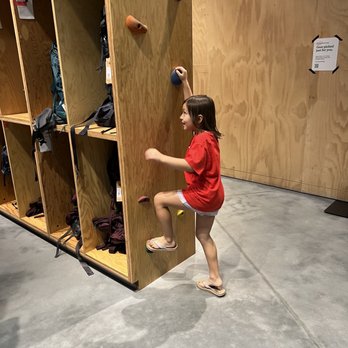 REI - Not a wall climbing wall. But she doesn't care - Bikes Near Me - Tampa, Florida