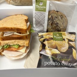 Catered lunch for our work event. A different turkey and bacon sandwich on tomato basil bread Catered lunch for our work event. A different turkey and bacon sandwich on tomato basil bread