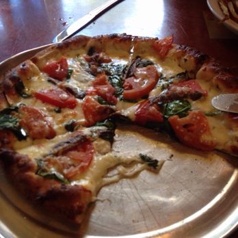 Sparky's Place Restaurant - White pizza with tomato, spinach and anchovies - Breakfast & Brunch Near Me - Astor, Florida Sparky's Place Restaurant - White pizza with tomato, spinach and anchovies - Breakfast & Brunch Near Me - Astor, Florida