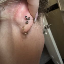 Cliff's Tattoo - Earring stuck - protruding from the back