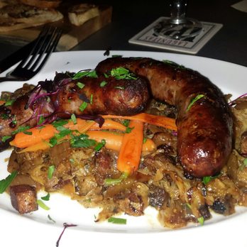 Centennial Crafted Beer & Eatery - Smoked Kielbasa with bacon lardons and beer braised cabbage. - Beer Bar Near Me - Chicago, Illinois Centennial Crafted Beer & Eatery - Smoked Kielbasa with bacon lardons and beer braised cabbage. - Beer Bar Near Me - Chicago, Illinois