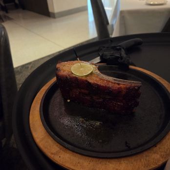 Perry's Steakhouse & Grille - Gilbert - Huge pork chop - Steakhouses Near Me - Gilbert, Arizona