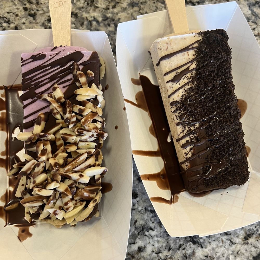 The Paleta Bar Glendale - Taro paleta bar dipped in milk chocolate and topped with almonds. Reese's paleta bar dipped in milk chocolate and Oreo cookie crumble - Ice Cream & Frozen Yogurt Near Me - Glendale, Arizona The Paleta Bar Glendale - Taro paleta bar dipped in milk chocolate and topped with almonds. Reese's paleta bar dipped in milk chocolate and Oreo cookie crumble - Ice Cream & Frozen Yogurt Near Me - Glendale, Arizona