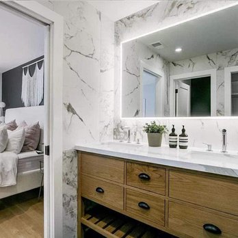 ACI - a bedroom with a bed and a vanity - General Contractors Near Me - Pacifica, California ACI - a bedroom with a bed and a vanity - General Contractors Near Me - Pacifica, California
