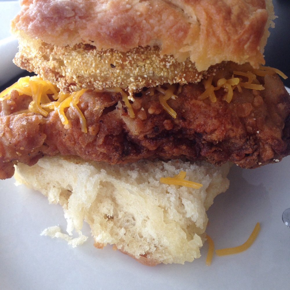 Mama's Boy - Fried Chicken Biscuit with cheese and a slice of fried green tomato. - Southern Near Me - Athens, Georgia Mama's Boy - Fried Chicken Biscuit with cheese and a slice of fried green tomato. - Southern Near Me - Athens, Georgia