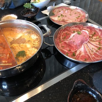 Shabu Squared - Left side soup base is the spicy crab soup and the right side is the spicy tonkotsu - Japanese Near Me - Houston, Texas Shabu Squared - Left side soup base is the spicy crab soup and the right side is the spicy tonkotsu - Japanese Near Me - Houston, Texas