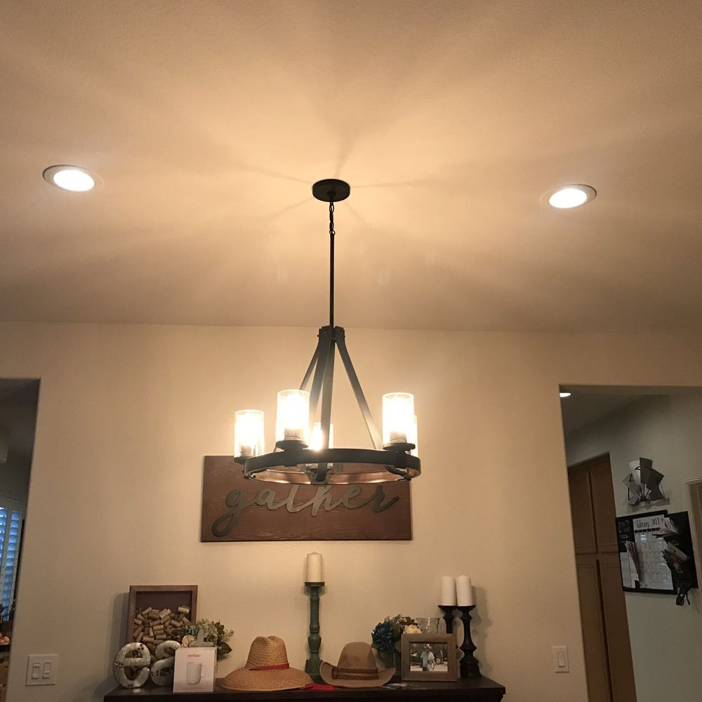 Chandelier and recessed lights.