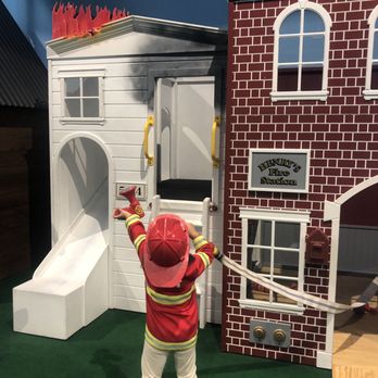 Unplug and Play - Themed zone-- burning home beside firehouse with ladder and slide. - Indoor Playcenter Near Me - Montclair, Virginia