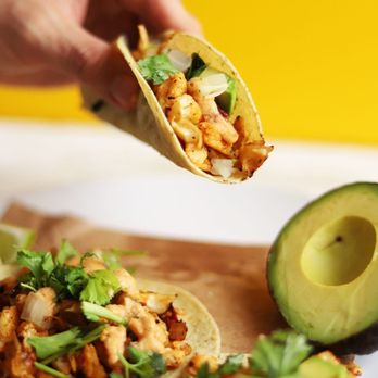 Saquic Taco - a hand holding a tortilla - Latin American Near Me - Dallas, Texas Saquic Taco - a hand holding a tortilla - Latin American Near Me - Dallas, Texas