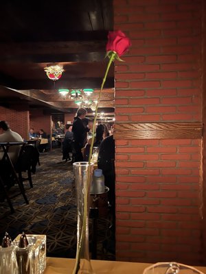 Photo of Hugo's Cellar - Las Vegas, NV, US. They give women beautiful, long stem roses right when you enter. Great touch to the start of our meal.